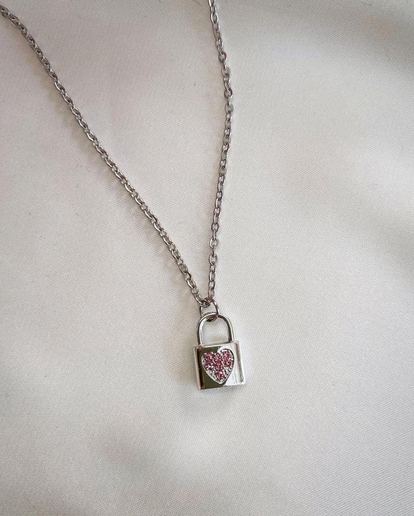 "Stunning Glittery Silver Lock Pendant - Unique Jewelry"